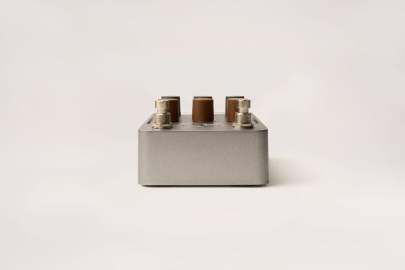Universal Audio OX Stomp - Side profile with a focus on its compact design.