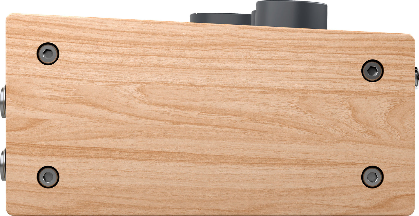 Universal Audio Volt 276 side profile highlighting natural wood panel and compact desktop chassis