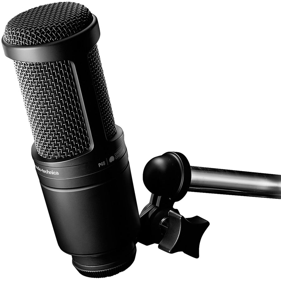 Side view of AT2020 microphone mounted on boom arm showing cardioid pattern icon and branding