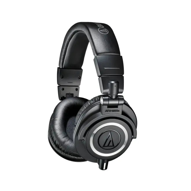 Angled view of ATH-M50x studio headphones with cushioned earcups and headband