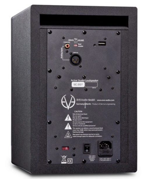 Rear panel of the EVE Audio SC207 active studio monitor showing XLR and RCA inputs, DIP switches, power switch, and AC power connection