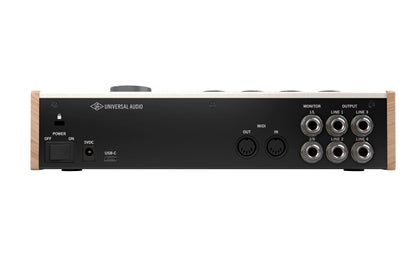 Back view of a Universal Audio audio interface with multiple connectors on a white background